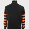 ART GALLERY CLOTHING SIXTIES MOD STYLE KNITWEAR Black, knitted roll neck pullover with burnt orange tipping on neck & burnt orange colour blocking on sleeves.